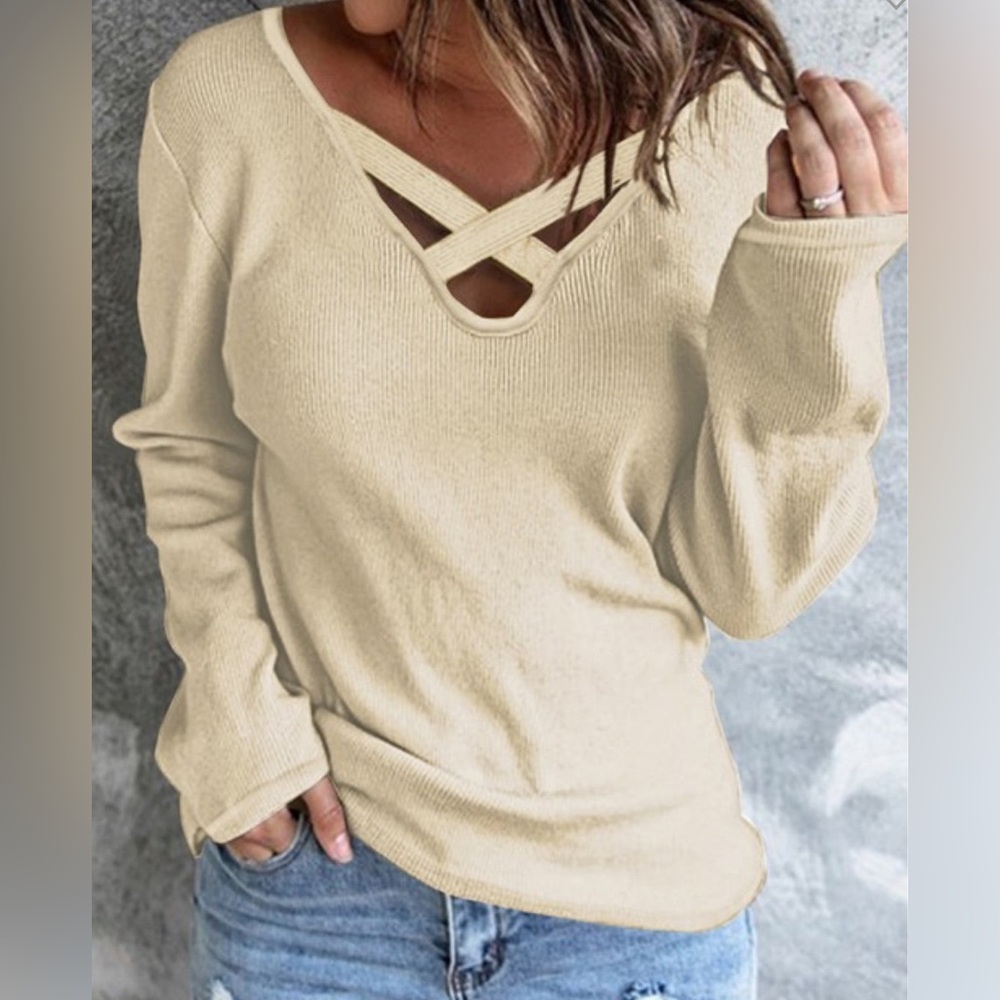 Criss cross neck sweater.